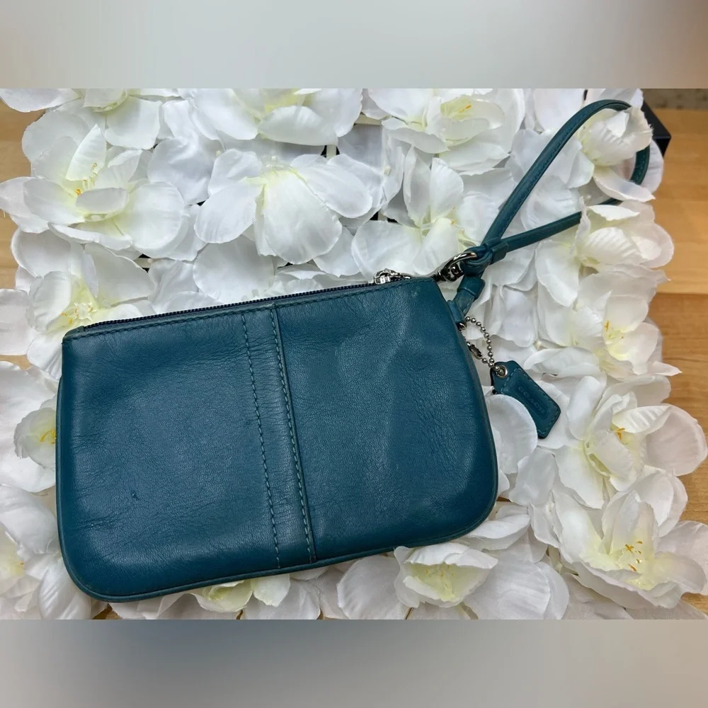 Coach Legacy Leather Small Wristlet. design is featured during Coach’s 65th